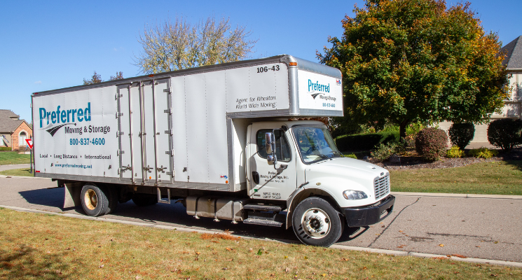 Preferred Moving & Storage team with clean moving truck, serving Metro Detroit communities like Shelby Township and Sterling Heights